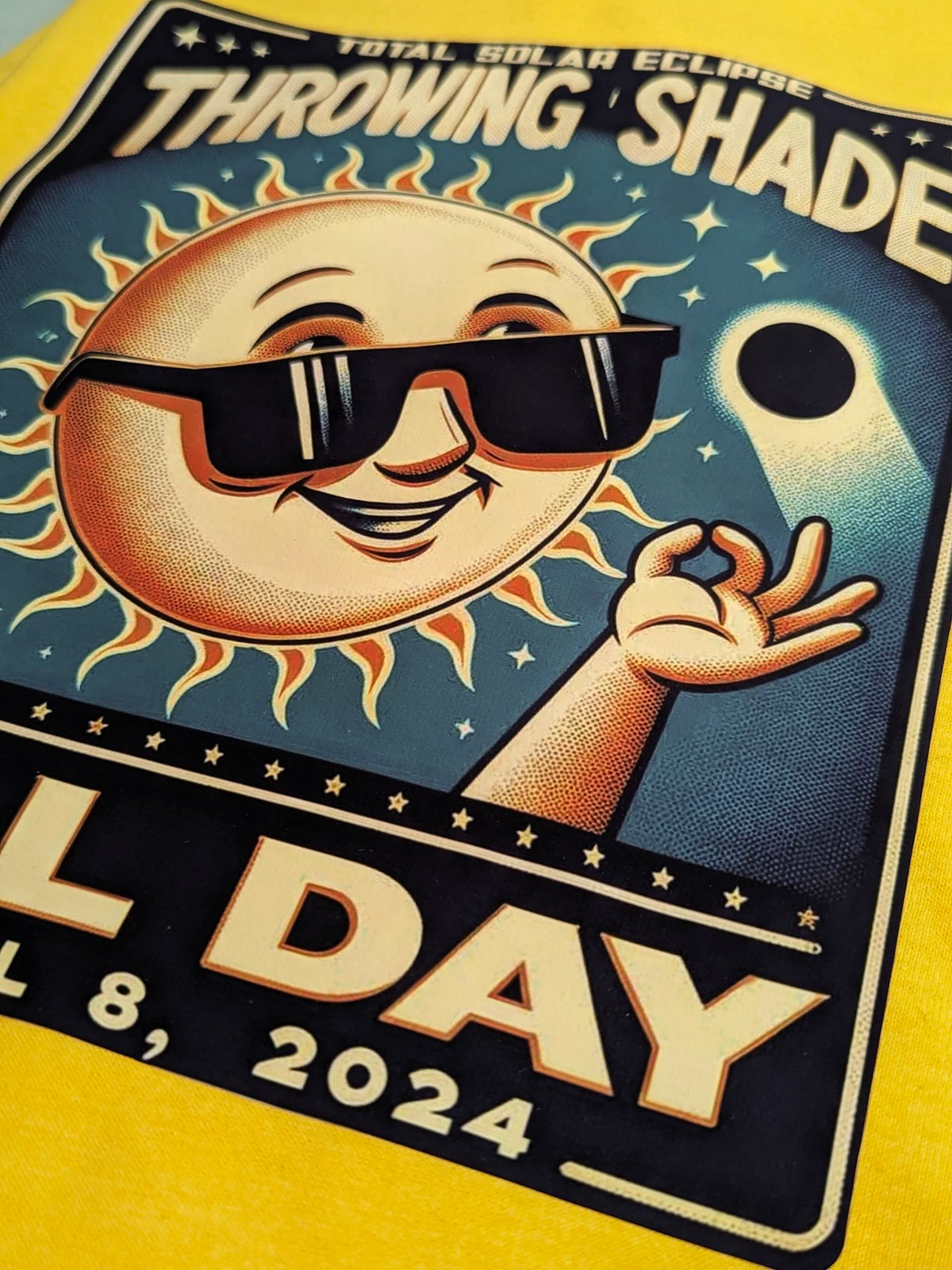 Custom iron-on transfer of a retro sun wearing sunglasses ironed onto a yellow t-shirt