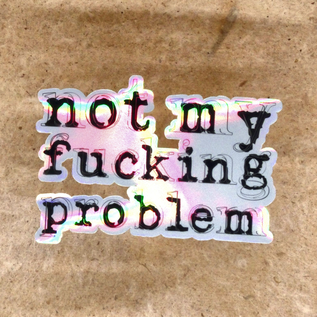 Not My Fucking Problem holographic die-cut vinyl sticker, real product photo