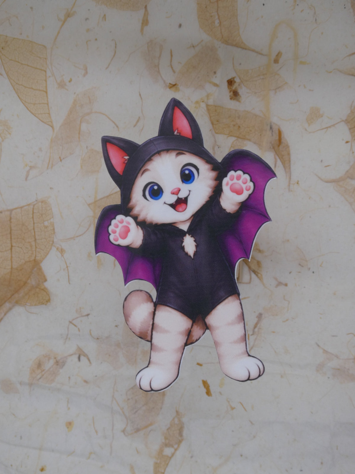 Bat Bobcat Halloween sticker - kitten in a purple-winged bat costume