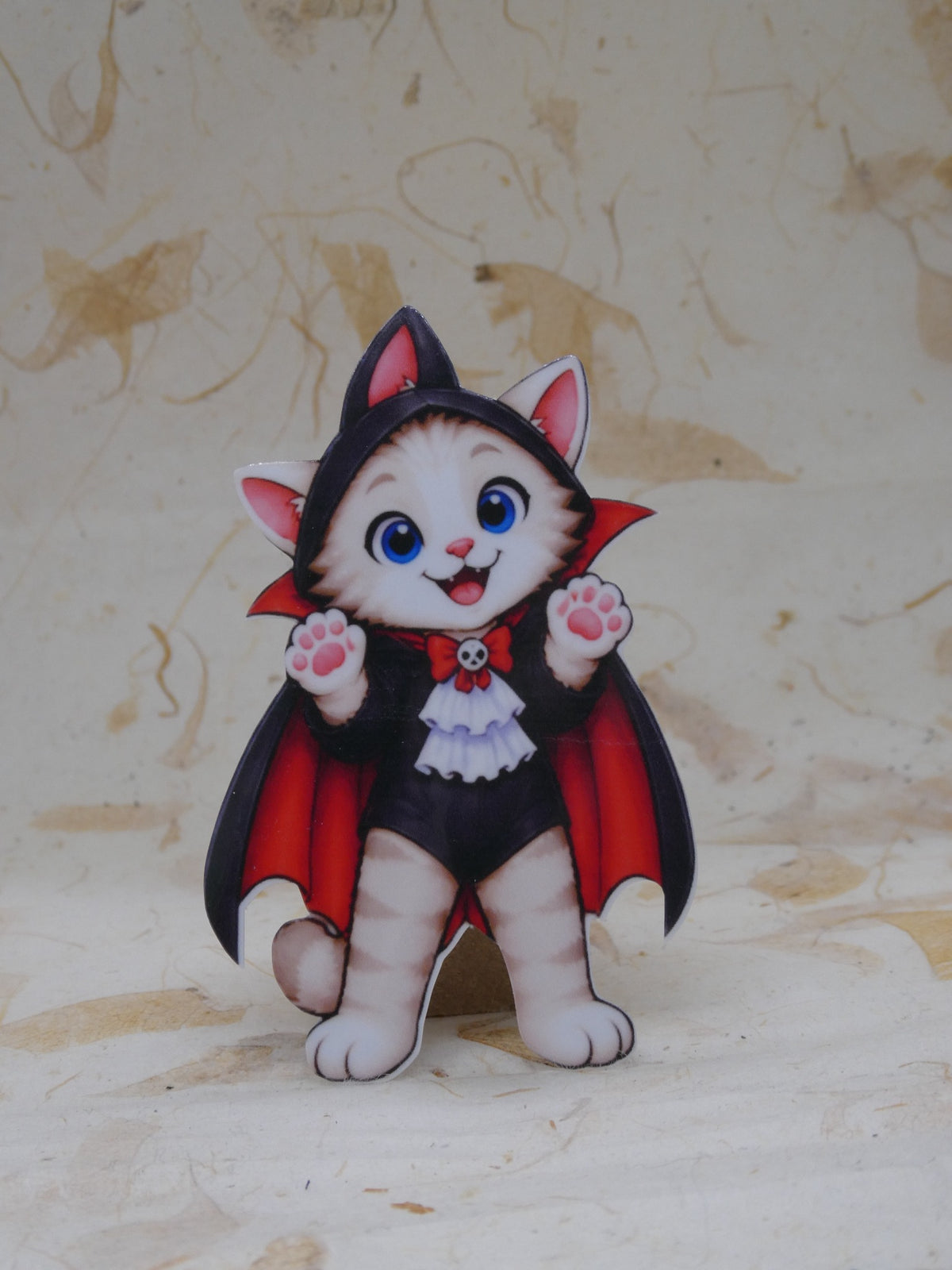 Vampire Bobcat Halloween sticker - kitten in a black and red cape