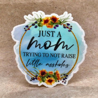 Sticker #3 Just A Mom Trying To Not Raise Little Assholes sunflower vinyl sticker, real product photo