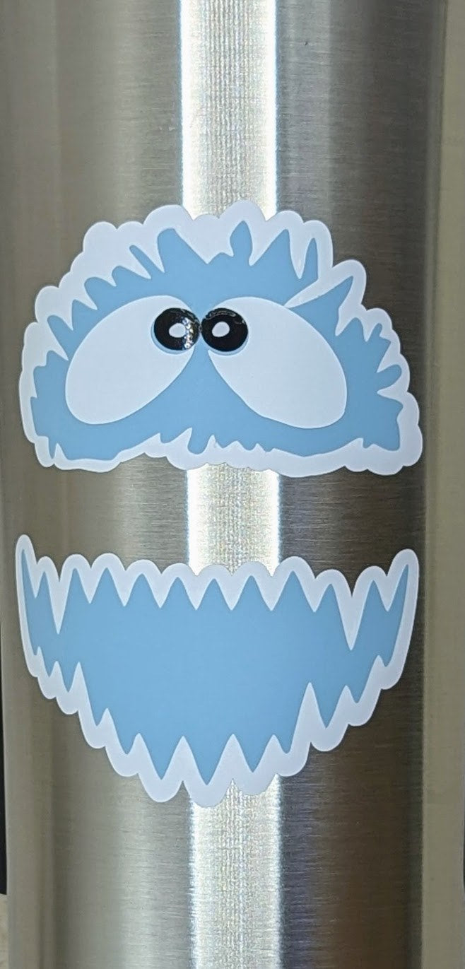 Yeti face vinyl decal applied to a stainless steel tumbler